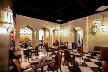 Journeys restaurant featuring Indian cuisine and an interior with arched design and warm lighting. Journeys restaurant featuring Indian cuisine and an interior with arched design and warm lighting.
