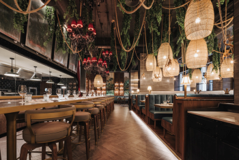 The Blind Butcher restaurant, a steakhouse interior with hanging lights and contemporary dining space. The Blind Butcher restaurant, a steakhouse interior with hanging lights and contemporary dining space.