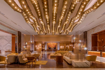 Luxury resort lobby with modern lighting design, seating areas, and open layout at Moon Palace The Grand – Cancun.