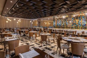 Large buffet restaurant with open seating, mosaic accents, and multiple dining stations.