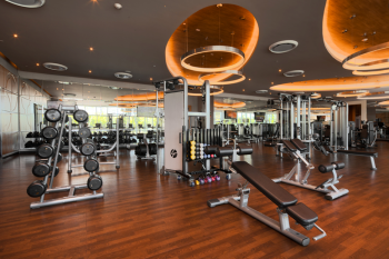 Modern fitness center with weight machines and equipment at Moon Palace The Grand – Cancun.
