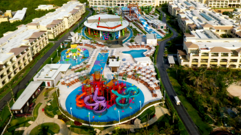 Aerial view of water park with slides, pools, and lazy river at Moon Palace The Grand – Cancun.