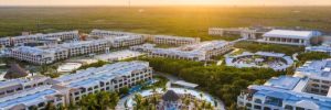 Aerial view of Moon Palace The Grand - Cancun beachfront resort with pools, suites, and Caribbean coastline.