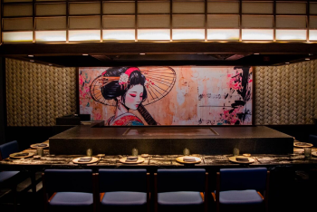 Teppanyaki-style dining setup with chef station and artistic décor at Zen restaurant
