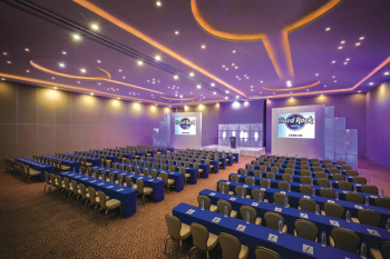 Ballroom event space with stage, seating, and lighting setup at Hard Rock Cancun