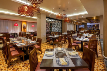 Interior of Los Caporales restaurant at Moon Palace Cancun featuring traditional Mexican-inspired décor and dining tables. Interior of Los Caporales restaurant at Moon Palace Cancun featuring traditional Mexican-inspired décor and dining tables.