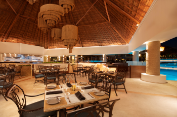 Open-air dining area at Palapa Asadero restaurant at Moon Palace Cancun serving grilled specialties in a casual resort setting. Open-air dining area at Palapa Asadero restaurant at Moon Palace Cancun serving grilled specialties in a casual resort setting.