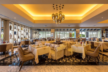 Elegant dining room inside Trattoria Italian restaurant at Moon Palace Cancun golf clubhouse. Elegant dining room inside Trattoria Italian restaurant at Moon Palace Cancun golf clubhouse.