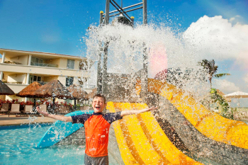 Children’s pool area with water slides and splash features at Moon Palace Cancun family-friendly resort. Children’s pool area with water slides and splash features at Moon Palace Cancun family-friendly resort.