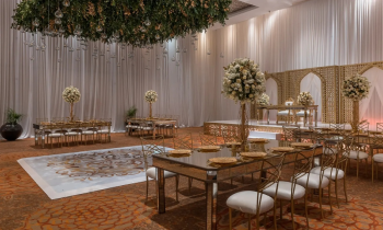 Elegant ballroom wedding reception setup at the Sunrise section of Moon Palace Cancun with floral décor, draping, and indoor event space. Elegant ballroom wedding reception setup at the Sunrise section of Moon Palace Cancun with floral décor, draping, and indoor event space.
