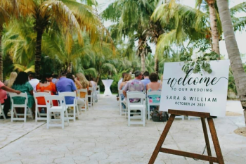 Outdoor ceremony at Frida Garden Terrace
surrounded by tropical landscaping and palm trees. Outdoor ceremony at Frida Garden Terrace
surrounded by tropical landscaping and palm trees.