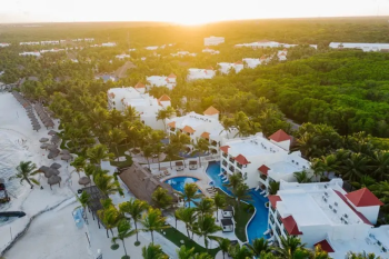 Aerial view of El Dorado Royale showcasing
beachfront accommodations, tropical landscapes, pools, and resort amenities
along the Riviera Maya coastline. Aerial view of El Dorado Royale showcasing
beachfront accommodations, tropical landscapes, pools, and resort amenities
along the Riviera Maya coastline.