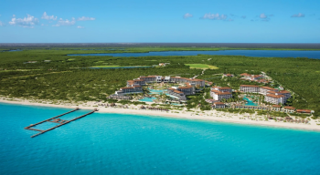 Aerial view of Dreams Playa Mujeres along the white sand coastline of Playa Mujeres, Mexico