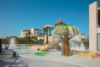 plash pad and children's playground with tree-shaped fountain at Dreams Playa Mujeres