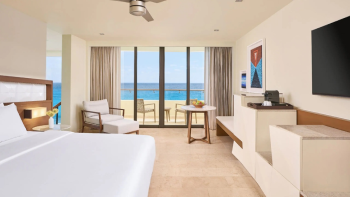 Oceanfront suite at Hyatt Ziva Cancun with private balcony, king bed, and Caribbean Sea views in Cancun